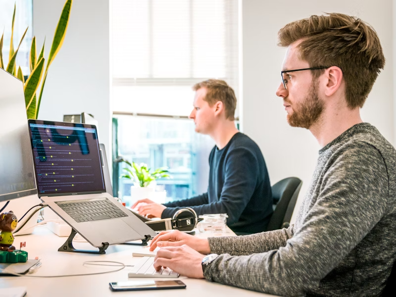 Professional IT team working with technology